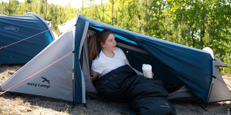 Woman Camping in Easy Camp Geminga 100 tent