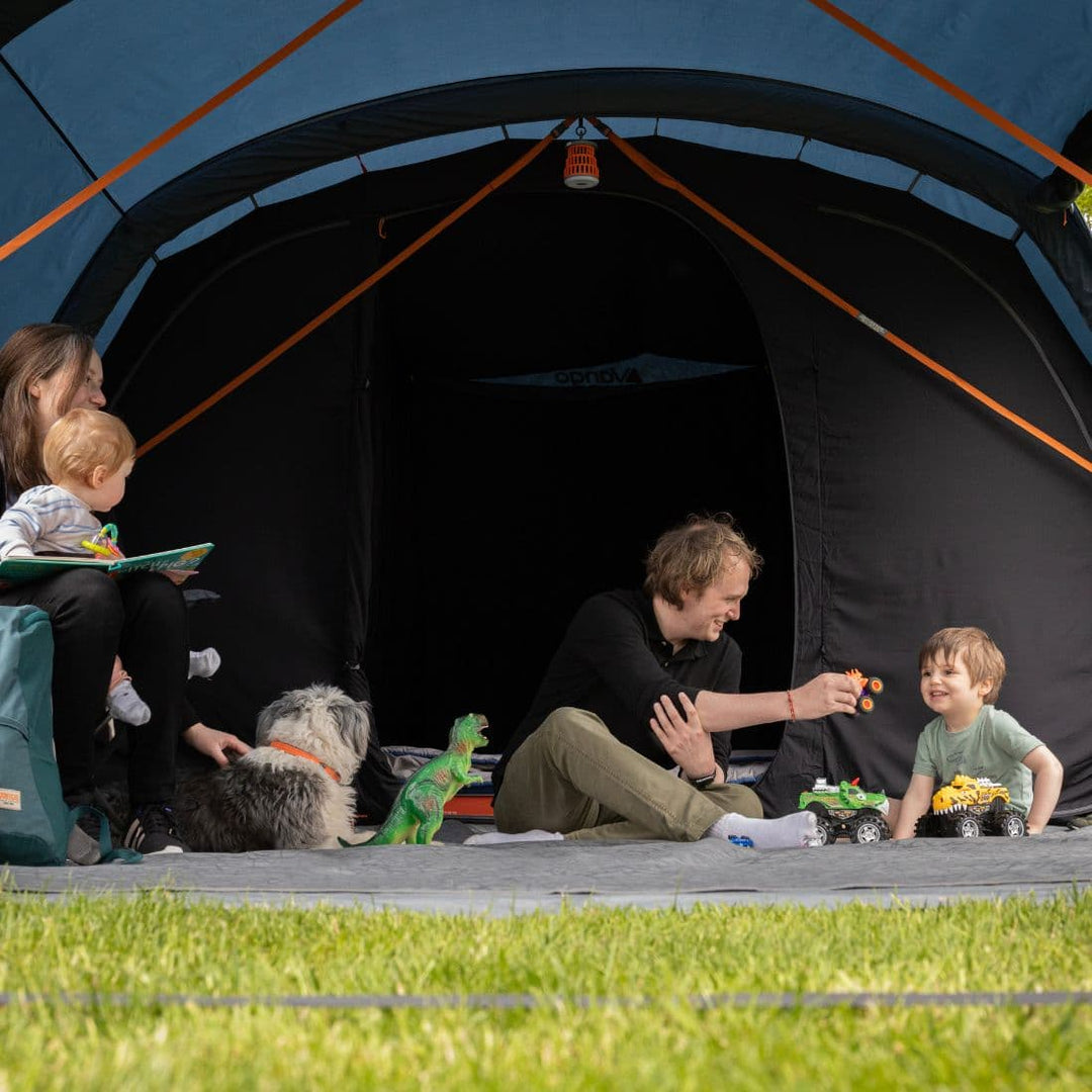 Vango Savannah Air 600xl with frotn door open with a family inside.