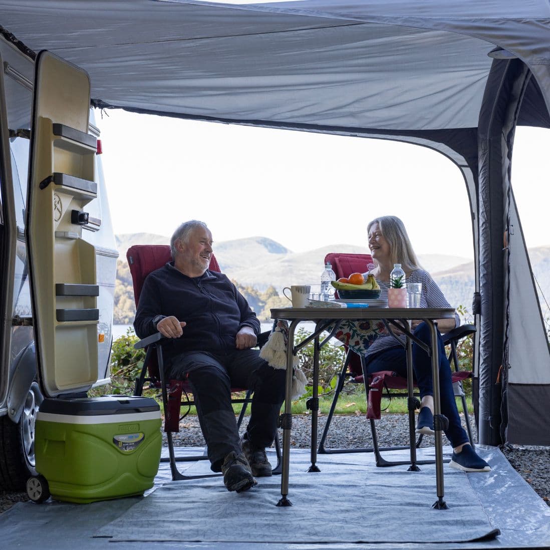 Side view of the Vango Sunlight Air sun canopy demonstrating its compatibility with camper vans.
