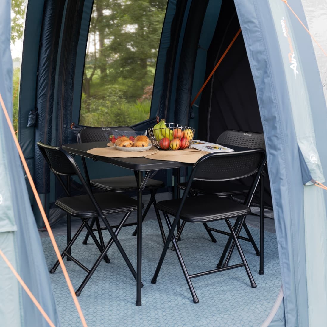Inside view of the Vango Tacoma Air 800xl tent with a camping table set up inside.