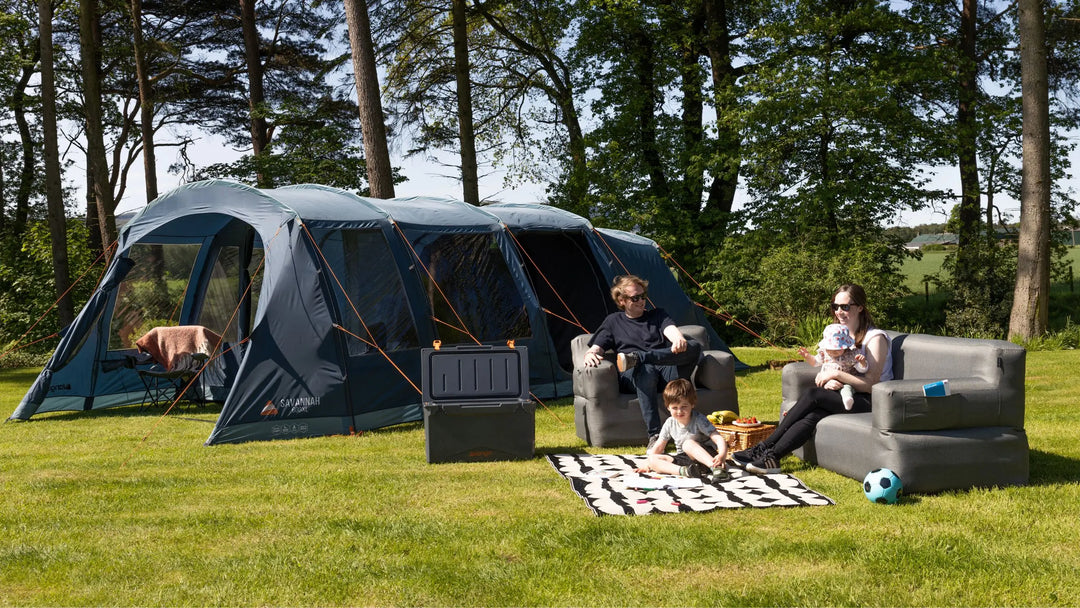 Vango Savannah 600xl poled tent in a shaded campsite, emphasizing traditional camping setups with durable materials.