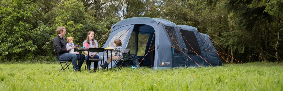 4 man tent set up in a forested area