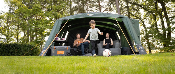 Family air tent pitched on a campsite.