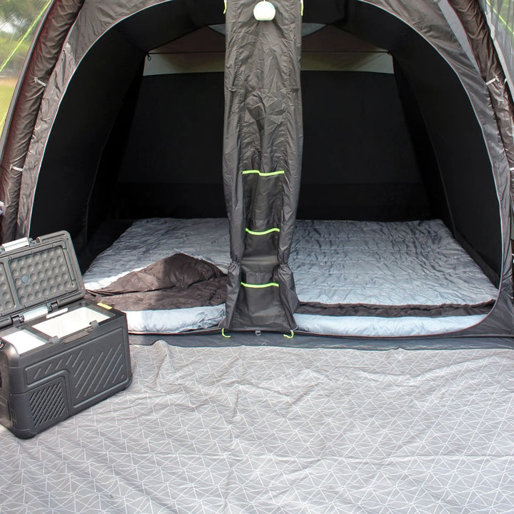 Outdoor Revolution Airedale 400T Air Tent interior with mattress and storage bag on a carpet