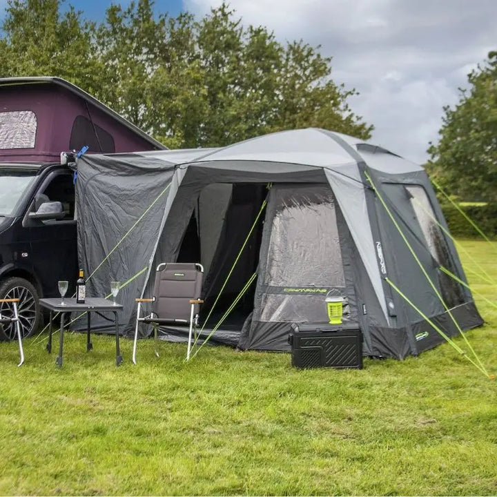Outdoor Revolution Cayman Air Low Drive Away Awning with camping furniture set up outside.