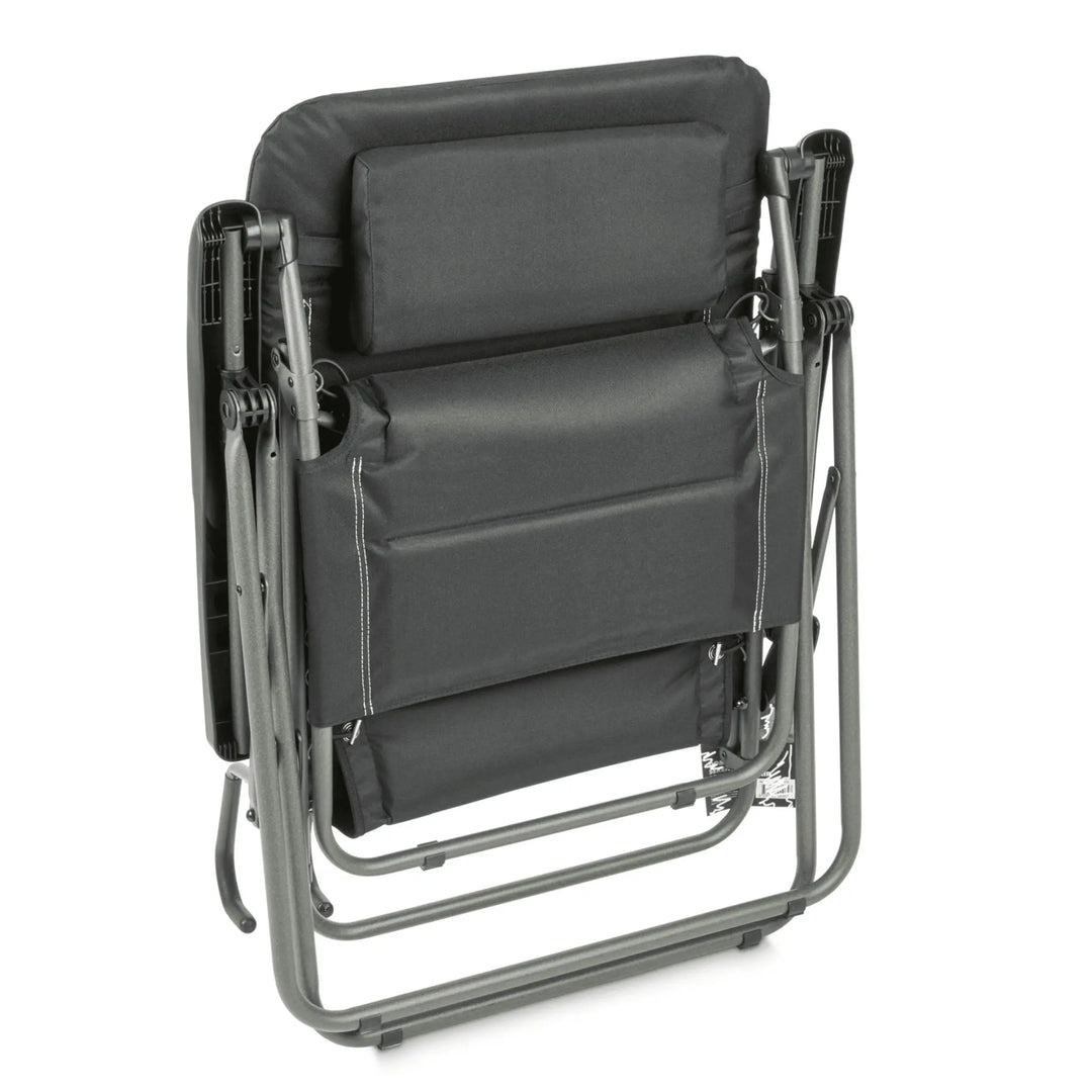 Folded Dometic Serene Firenze Relaxer Chair in an upright position, showing its space-saving design.