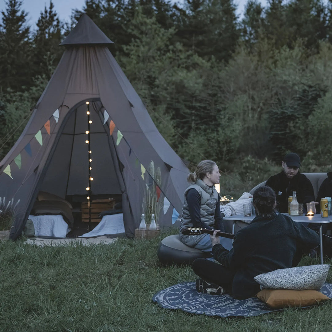 Easy Camp Blur Light Chain attached to a tipi tent.
