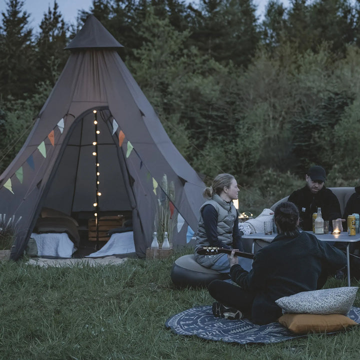 Easy Camp Blur Light Chain attached to a tipi tent.