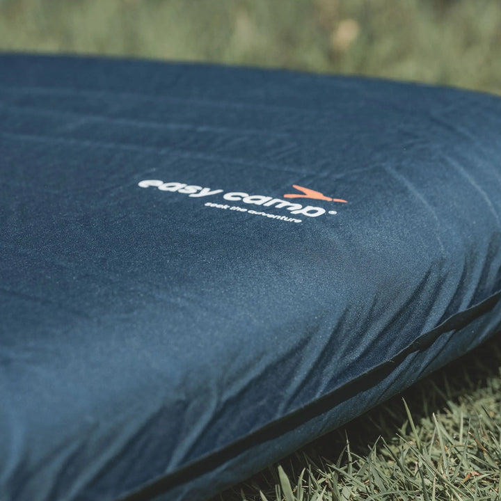 Easy Camp Skylark Mat Single 10cm Self Inflating Mattress with 'easy camp' logo on a grassy background