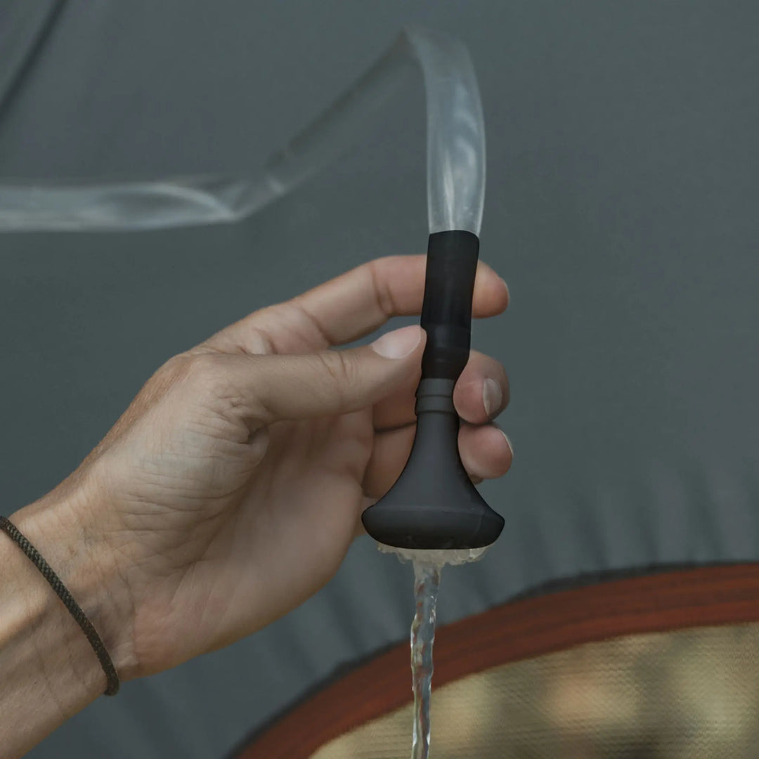 Lifestyle image of the Easy Camp Solar Shower in use