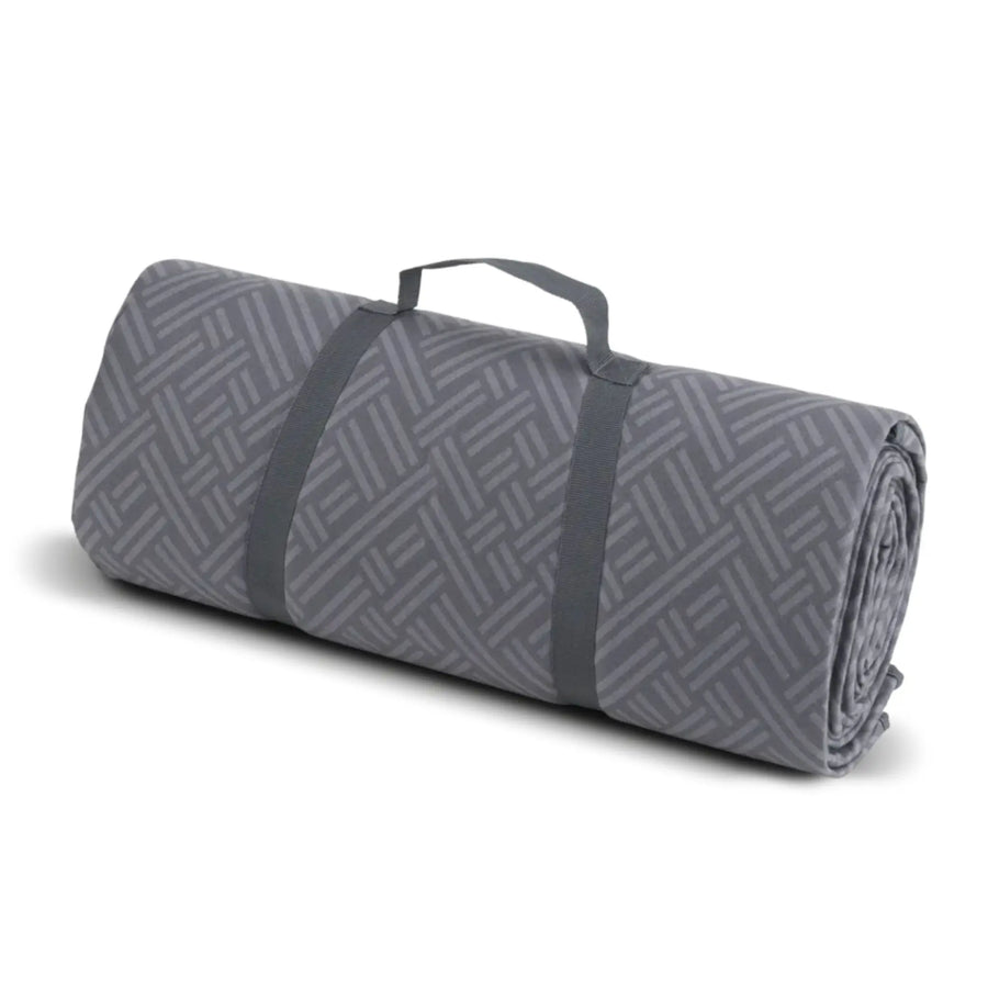 Easy Camp Universal carpet rolled up with carry straps, making it compact and easy to transport.