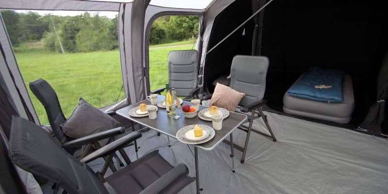 Camping chairs, tables, storage units and kitchen stands