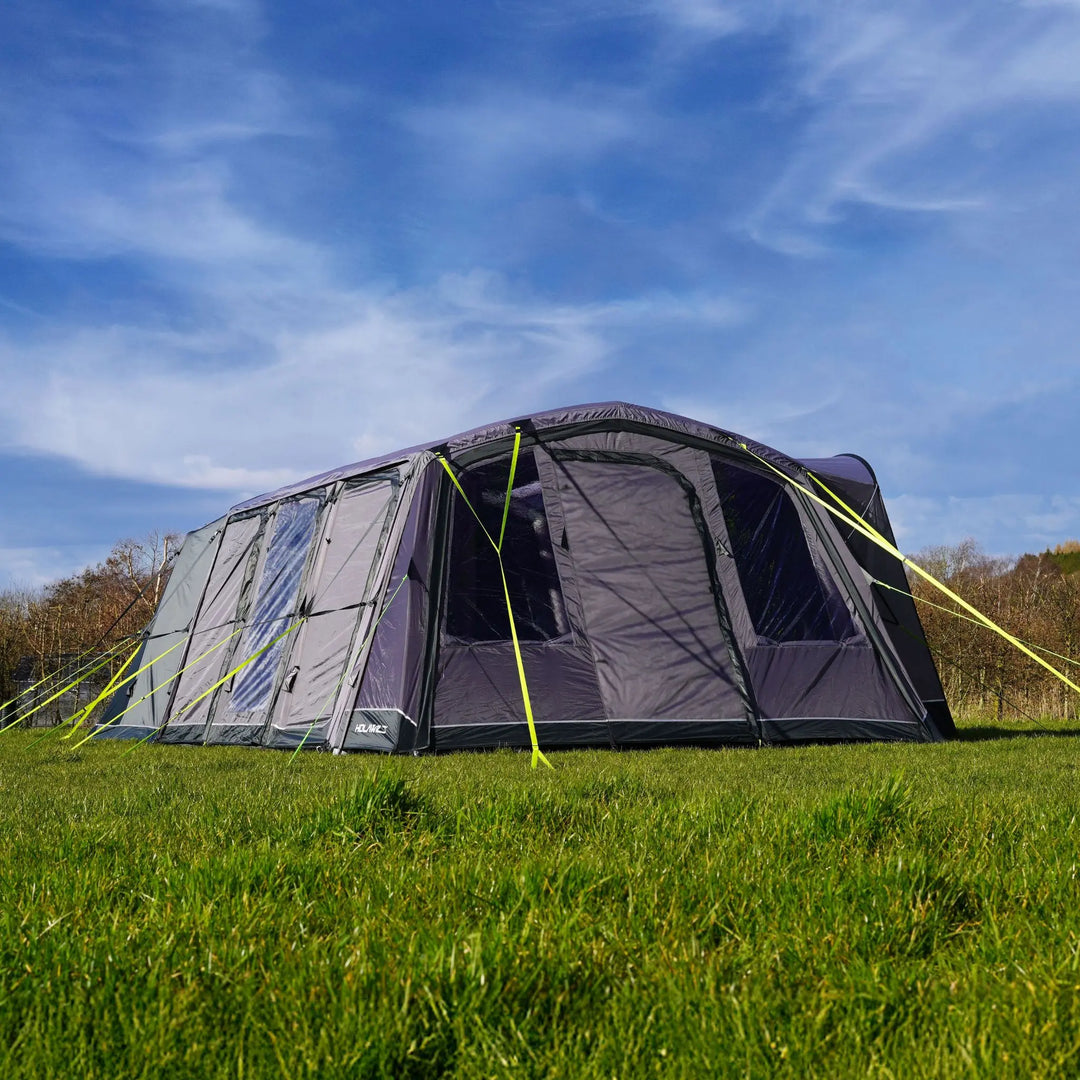 Holawild Airtek Parkhurst 4.0 Tent pitched in a field with blue skies in the background.