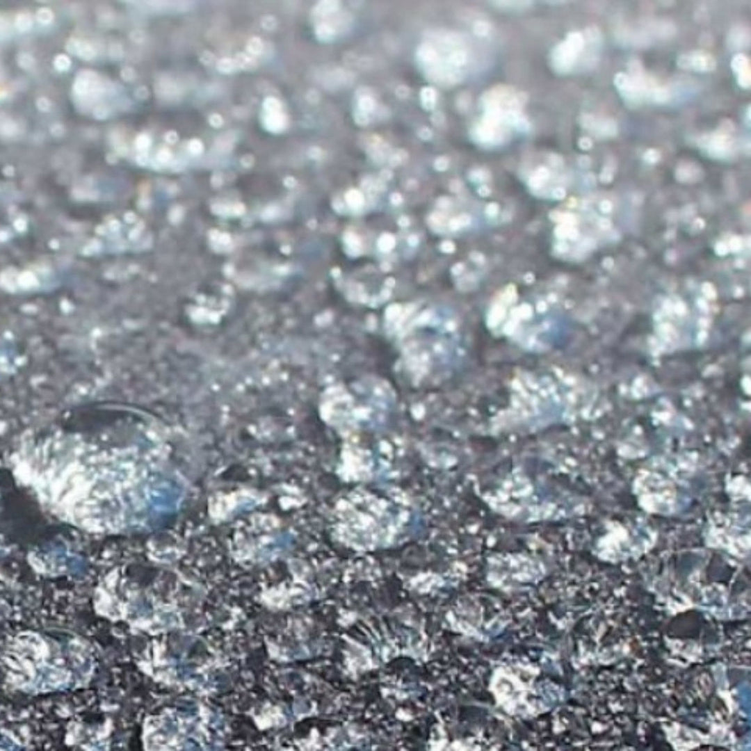 Close-up of the Outdoor Revolution 120HDE Hex high-density all-weather lightweight fabric, featuring a 3000mm HH waterproof rating. The image highlights water droplets beading on the durable, weather-resistant material, showcasing its reliability for outdoor use.