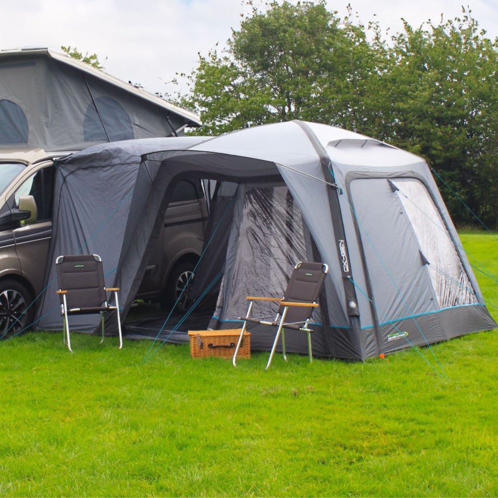 A side view of the Outdoor Revolution Cayman Air Low Drive Away campervan awning highlights its durable materials and large window panels, perfect for ventilation and natural light.