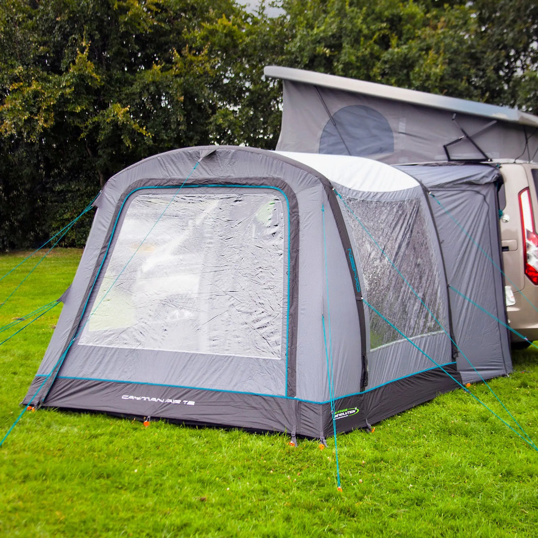 The side view of the Outdoor Revolution Cayman Air T2 Low campervan awning, demonstrating its seamless attachment to the vehicle. Outdoor Revolution's innovative air technology ensures quick setup and durability.