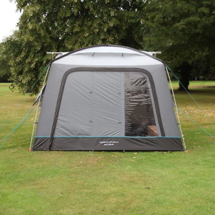 Outdoor Revolution Cayman Cuda DT Awning set up on grass with trees in the background