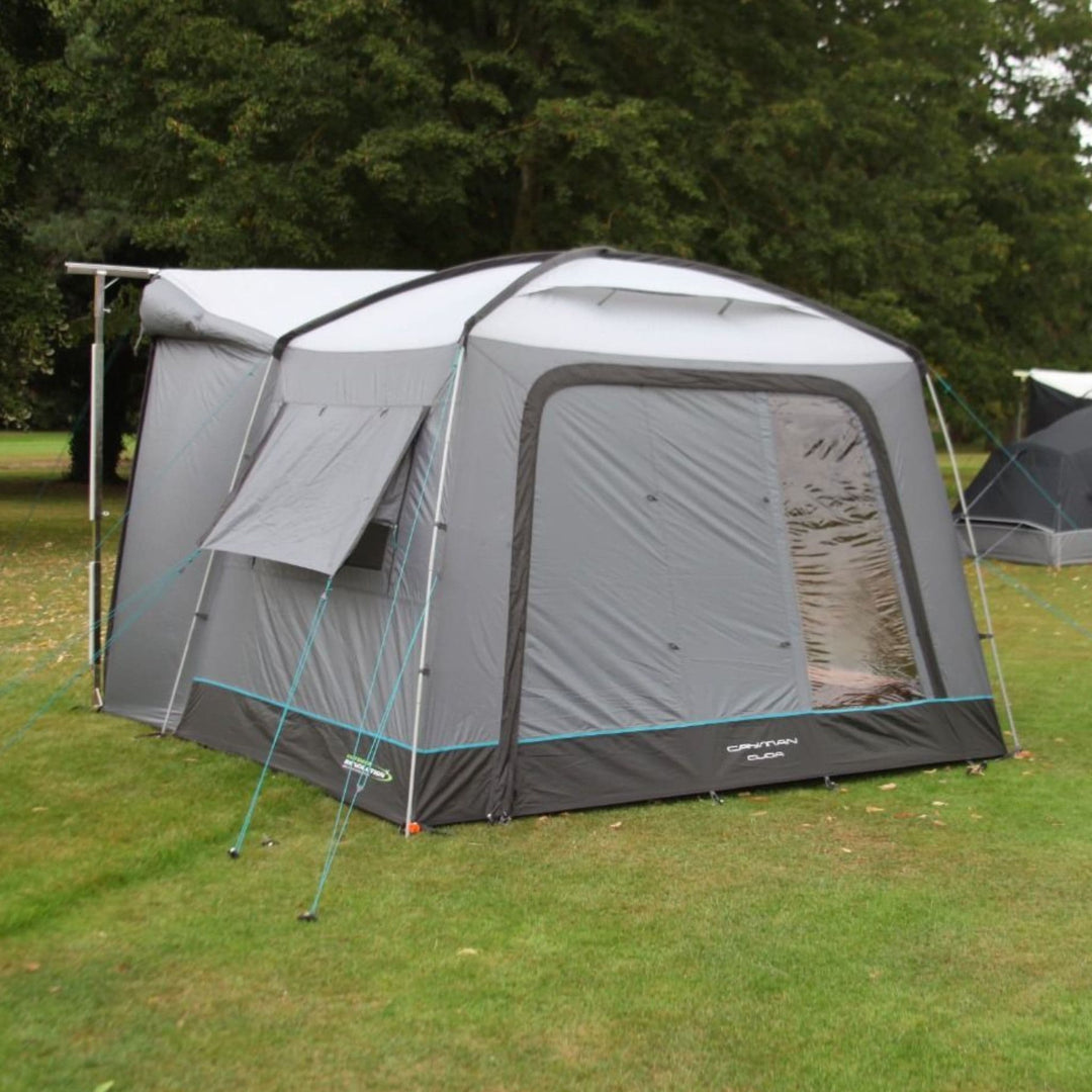 A side angle highlights the fully sealed structure of the Cayman Cuda F/G Awning, with its guylines providing added stability in windy conditions.