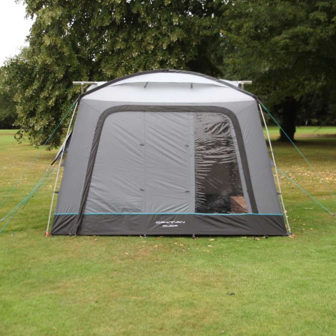 Front view of the Cayman Cuda F/G Awning with window open to reveal its spacious interior, perfect for relaxing or dining while camping with a campervan.