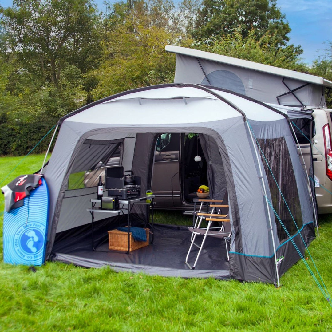 Side view of the Cayman Cuda XL F/G Drive Away Awning connected to a campervan, illustrating its extended space and compatibility with pop-top vehicles.