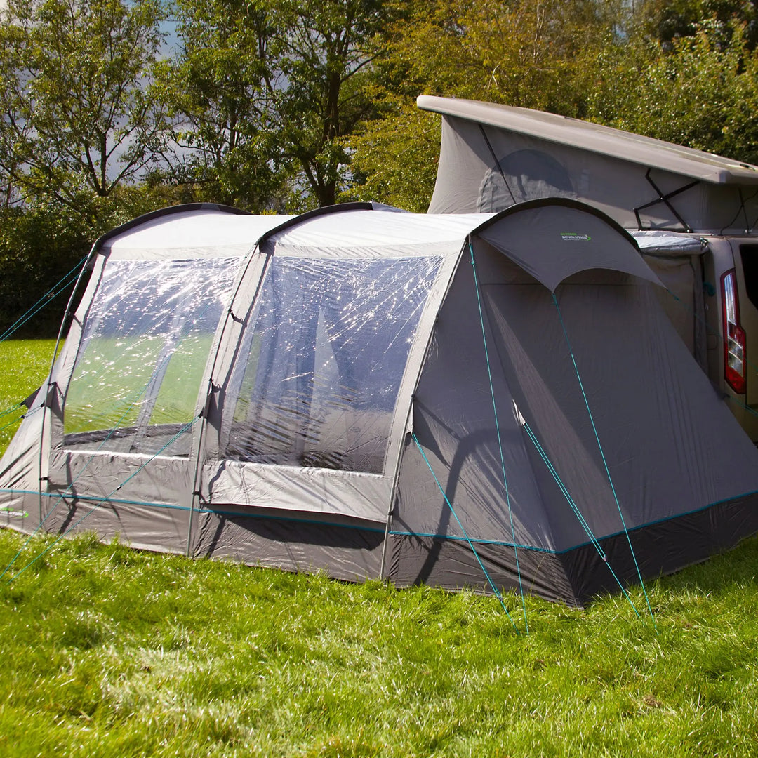 Rear angle of the Outdoor Revolution Cayman T3 DT Low Drive Away Awning, showing the connection tunnel securely attached to the campervan. The awning’s streamlined design ensures a weatherproof and versatile camping experience.