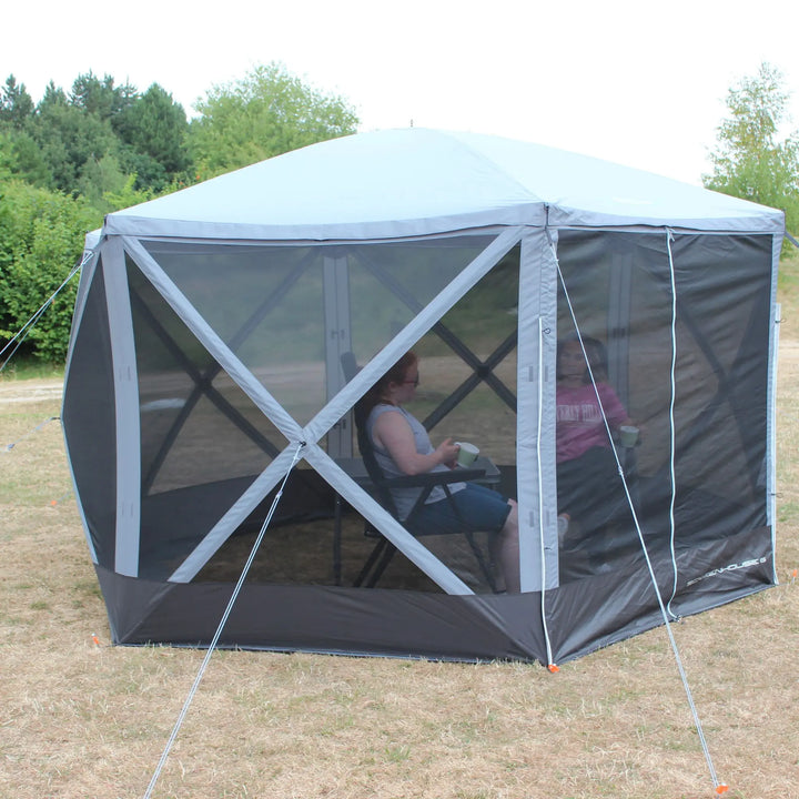 Side view of the Outdoor Revolution Screenhouse 6 shelter with mesh panels, showing an airy and bug-free camping experience.