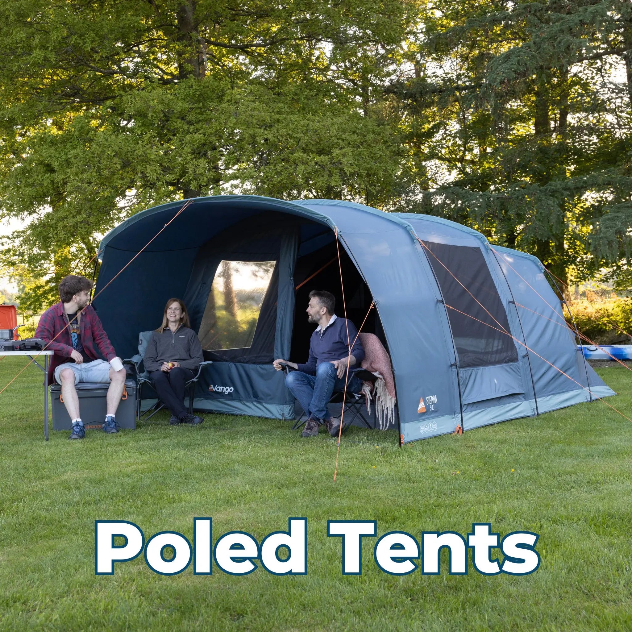 Poled Tents – Vango poled tent pitched in a grassy field, with campers sitting and enjoying the outdoors.