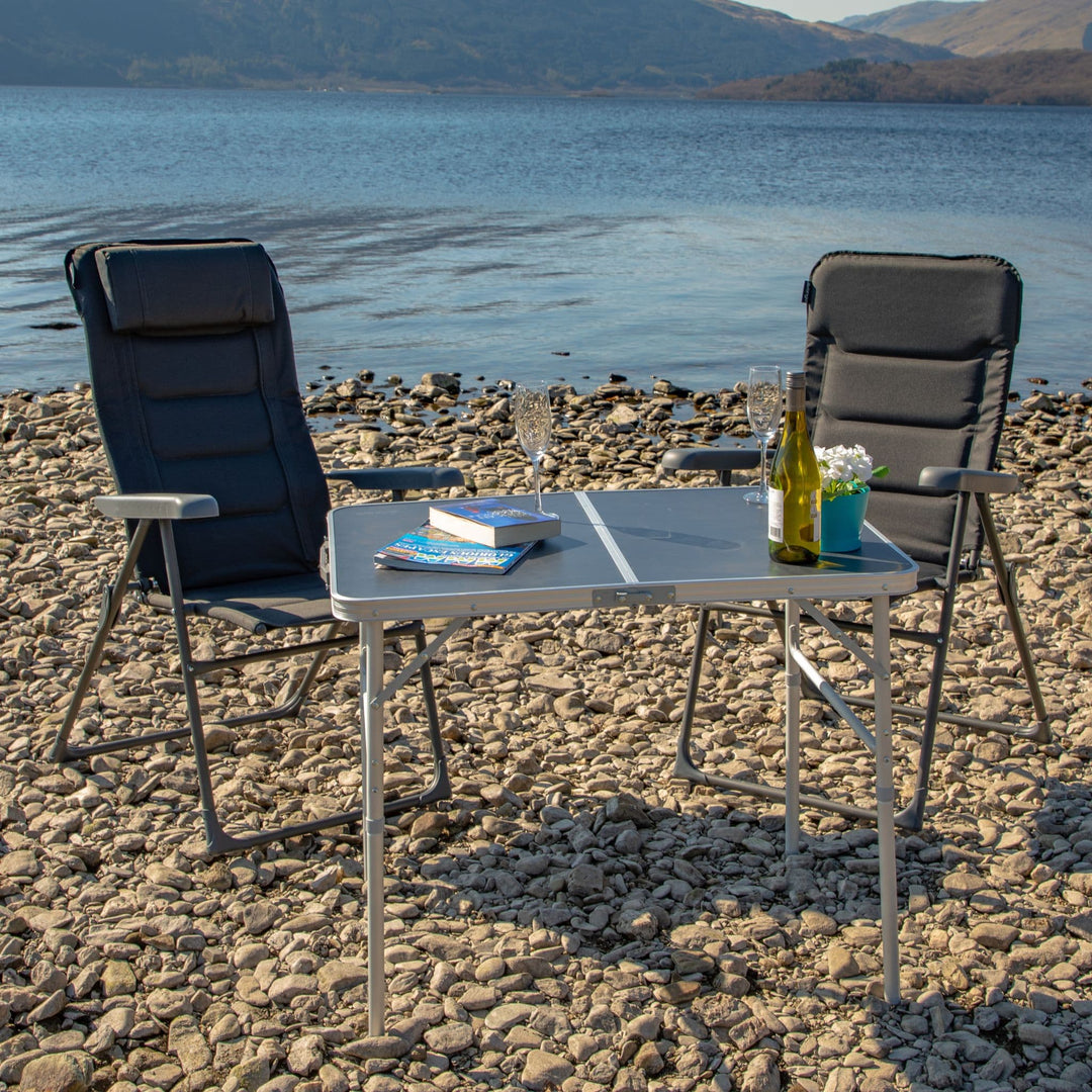 Vango Hampton Chairs On beach with table next to them