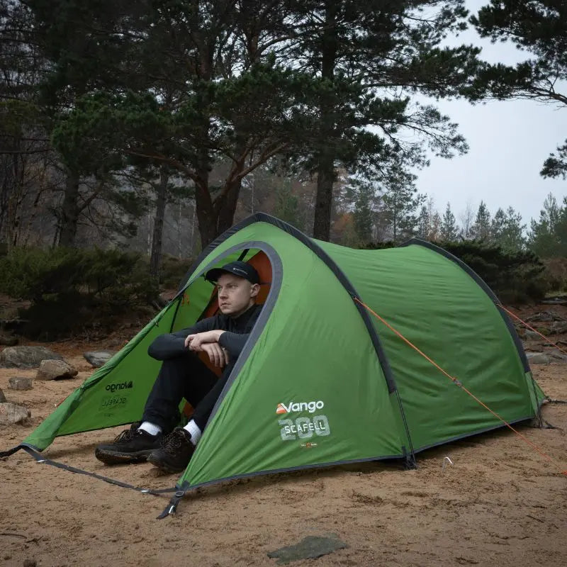 Vango Scafell 200 Tent pitch on sand near woodland.