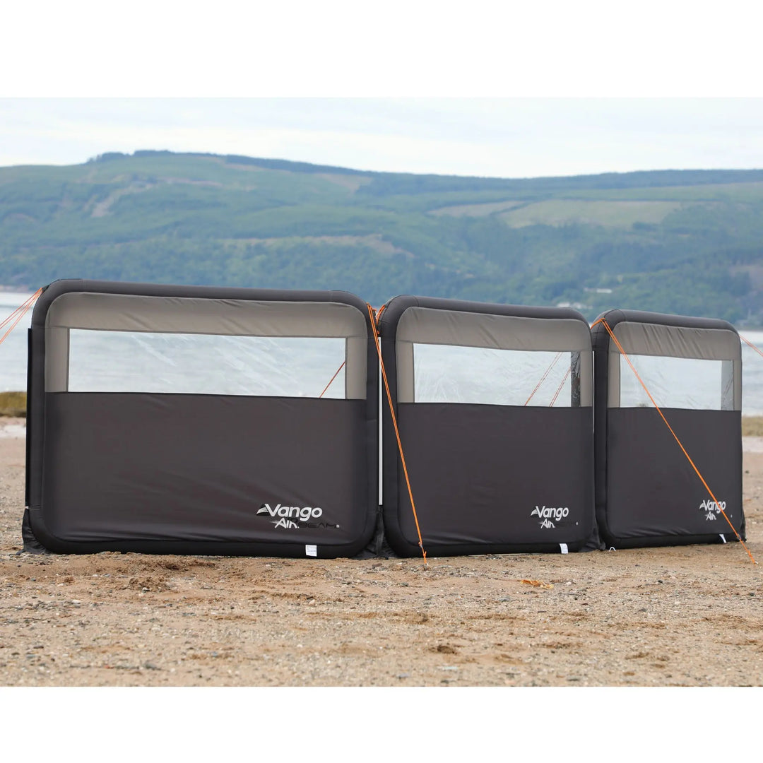 Vango AirBeam Modular Windbreak on a beach with a scenic background