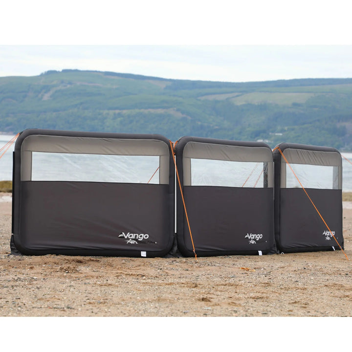 Vango AirBeam Modular Windbreak on a beach with a scenic background