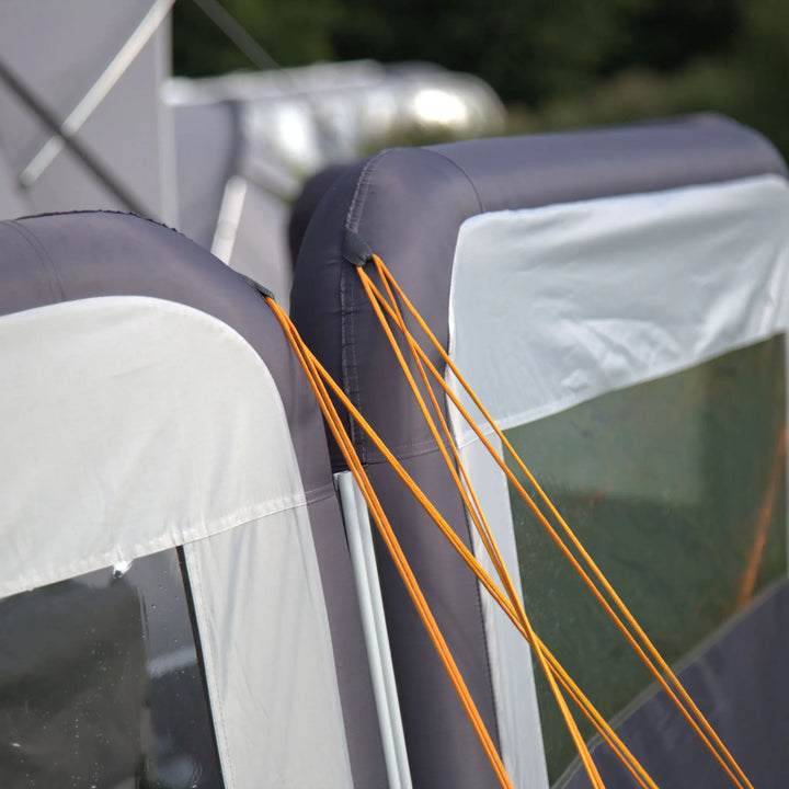 Close-up of a Vango AirBeam Modular Windbreak with orange ropes and gray and white fabric