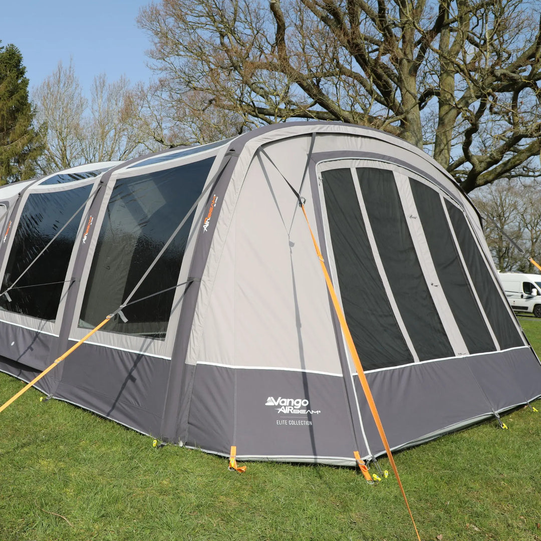 Vango AirBeam Anantara IV Air 650XL tent set up on grass, displaying its large front windows and AirBeam inflatable frame.