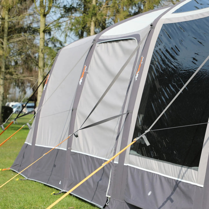 Side panel of the Vango AirBeam Anantara IV Air 650XL family tent, with large diamond-clear windows, side door and zipped adjustable privacy curtains.