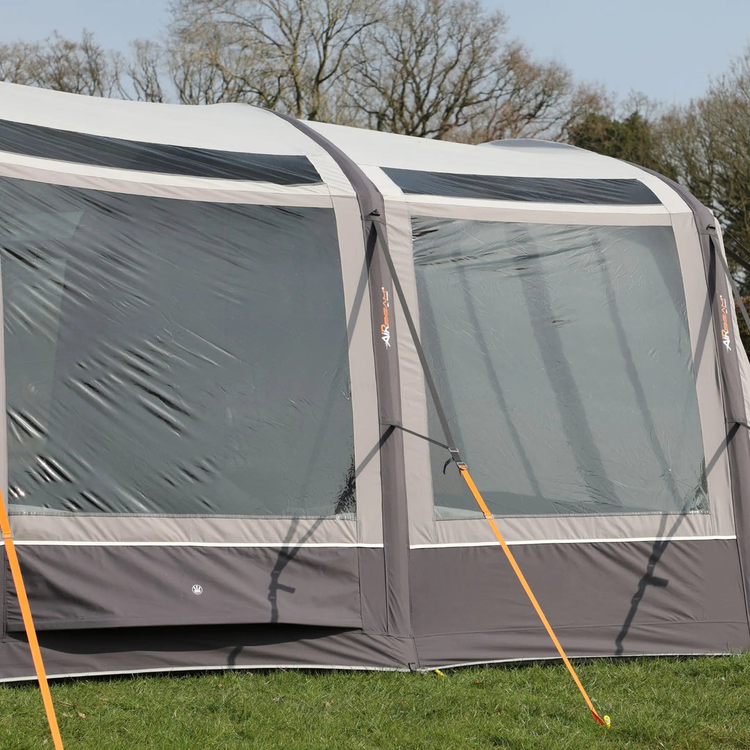 Side panel of the Vango AirBeam Anantara IV Air 650XL family tent, with large diamond-clear windows and adjustable privacy curtains.