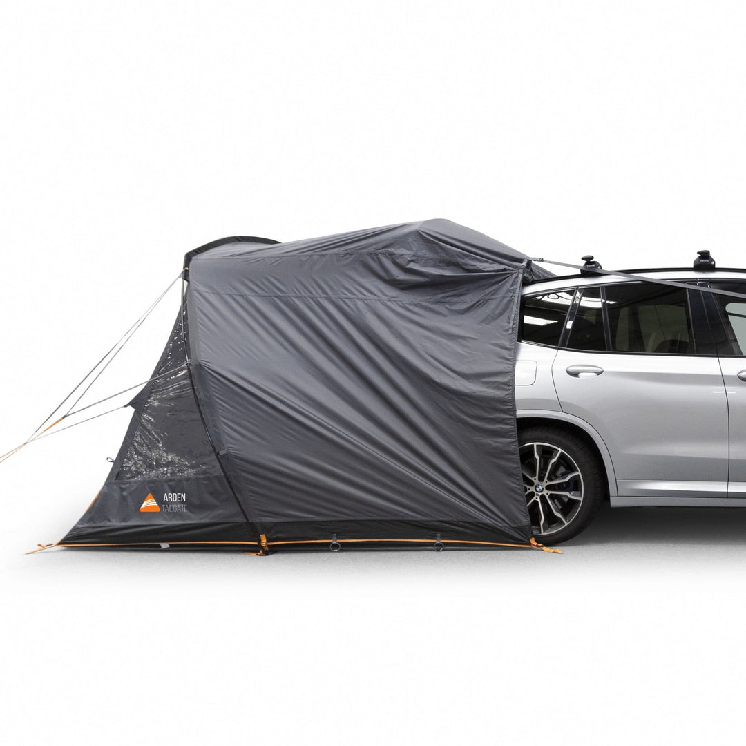 Side angle of the Vango Arden Tailgate Awning attached to a silver vehicle, emphasizing its compact design.