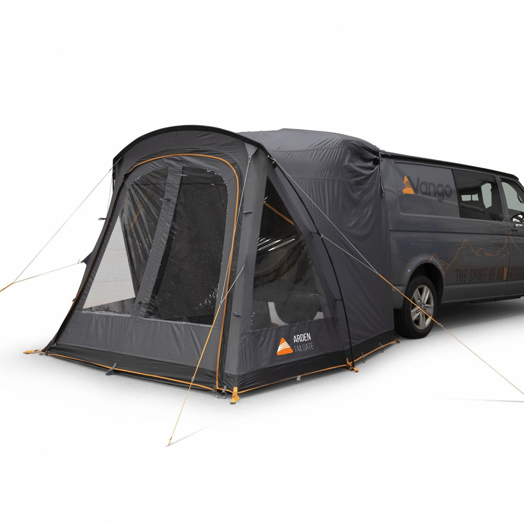 Side view of the Vango Arden Tailgate Awning attached to a campervan, showcasing its windows open to allow light into the tailgate awning.