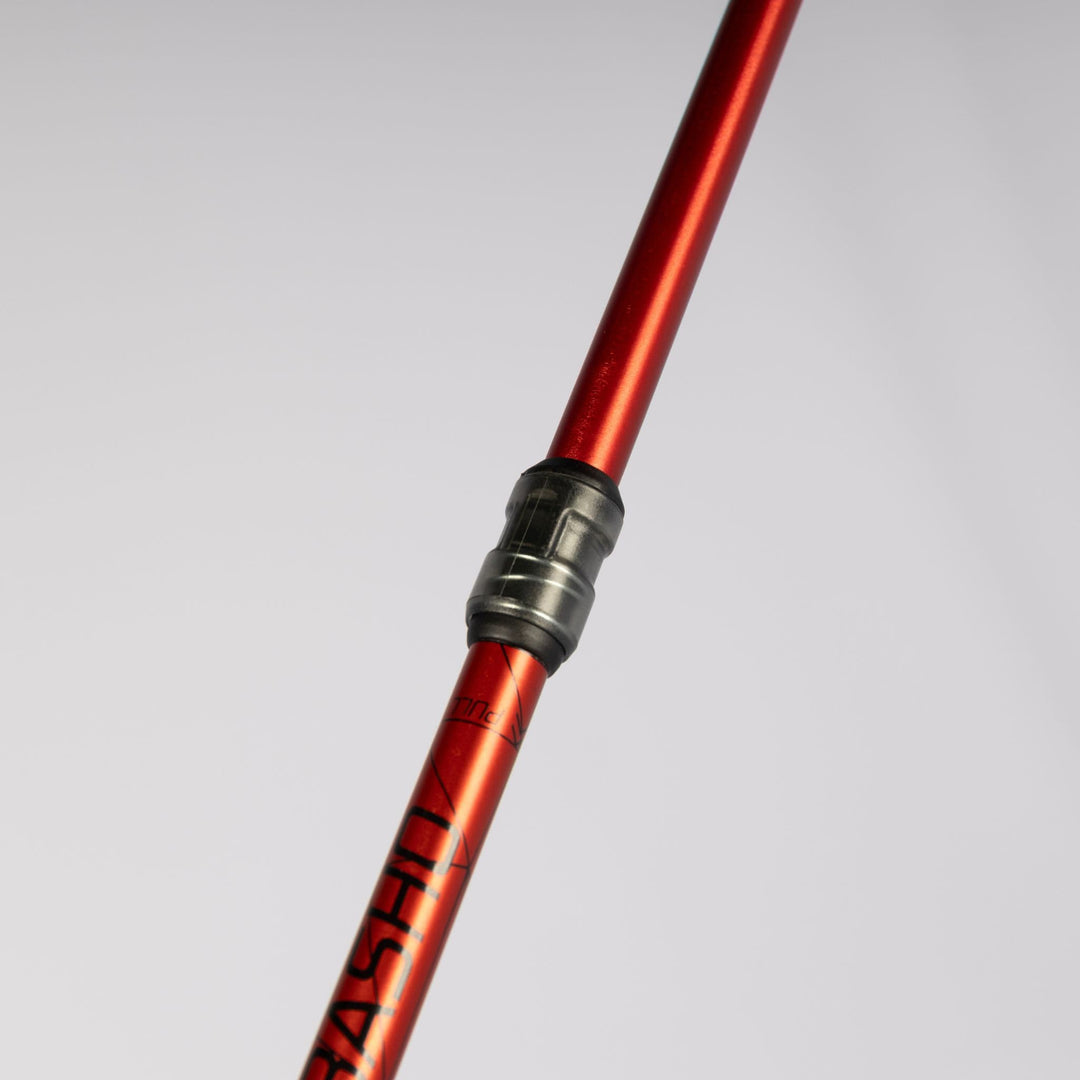 Close-up of the red shaft on the Vango Basho Folding Walking Pole, ideal for trekking and hiking.