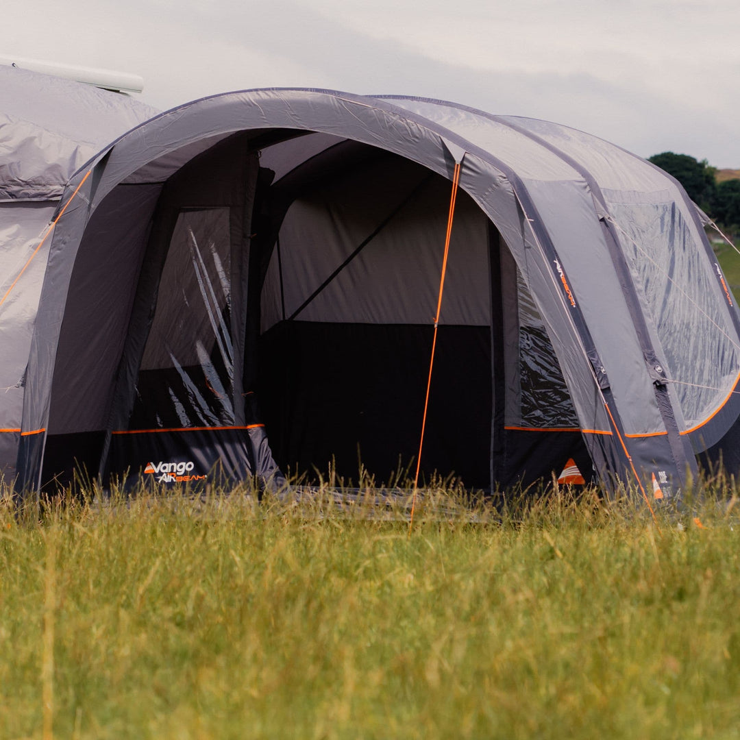 A Vango Cove III Air Low Drive Away Awning attached to a VW Campervan, highlighting the pre-attached front canopy.