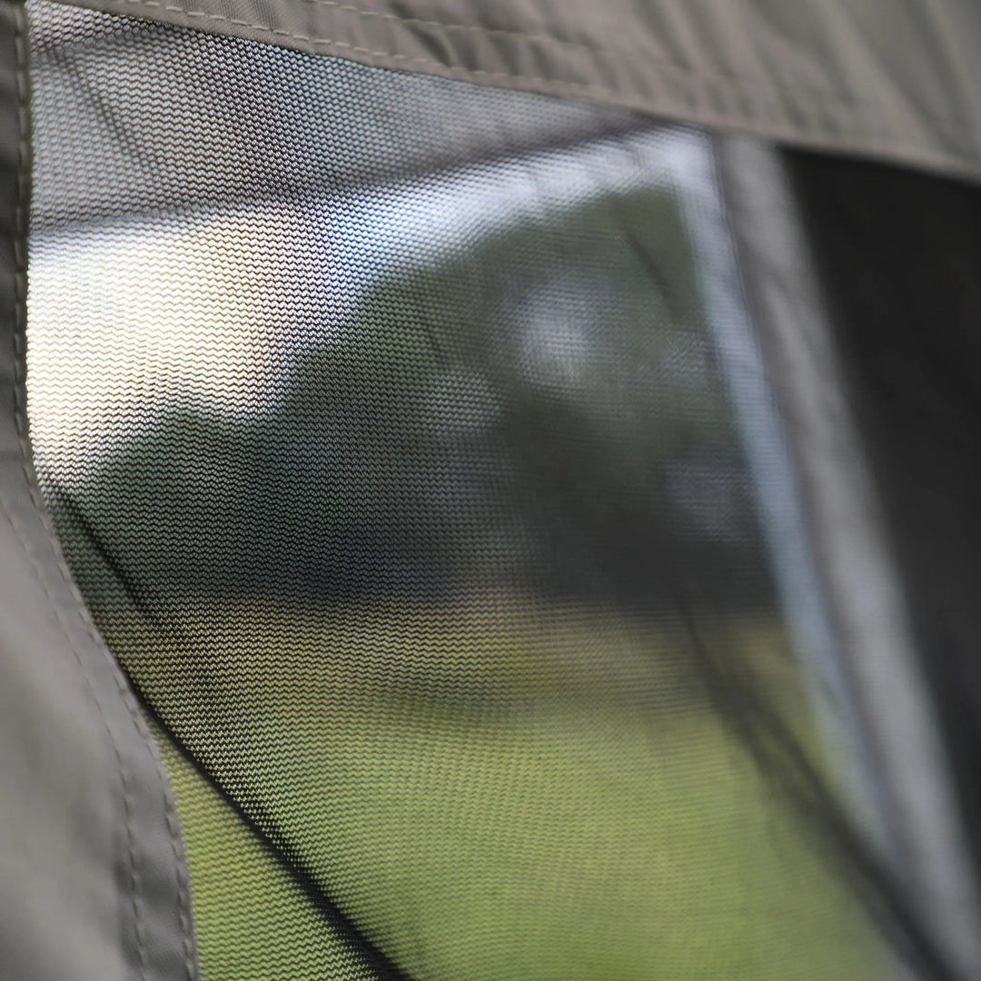 Close-up of the mesh window in the Vango Cove III Air Low awning, showcasing ventilation and insect protection features.