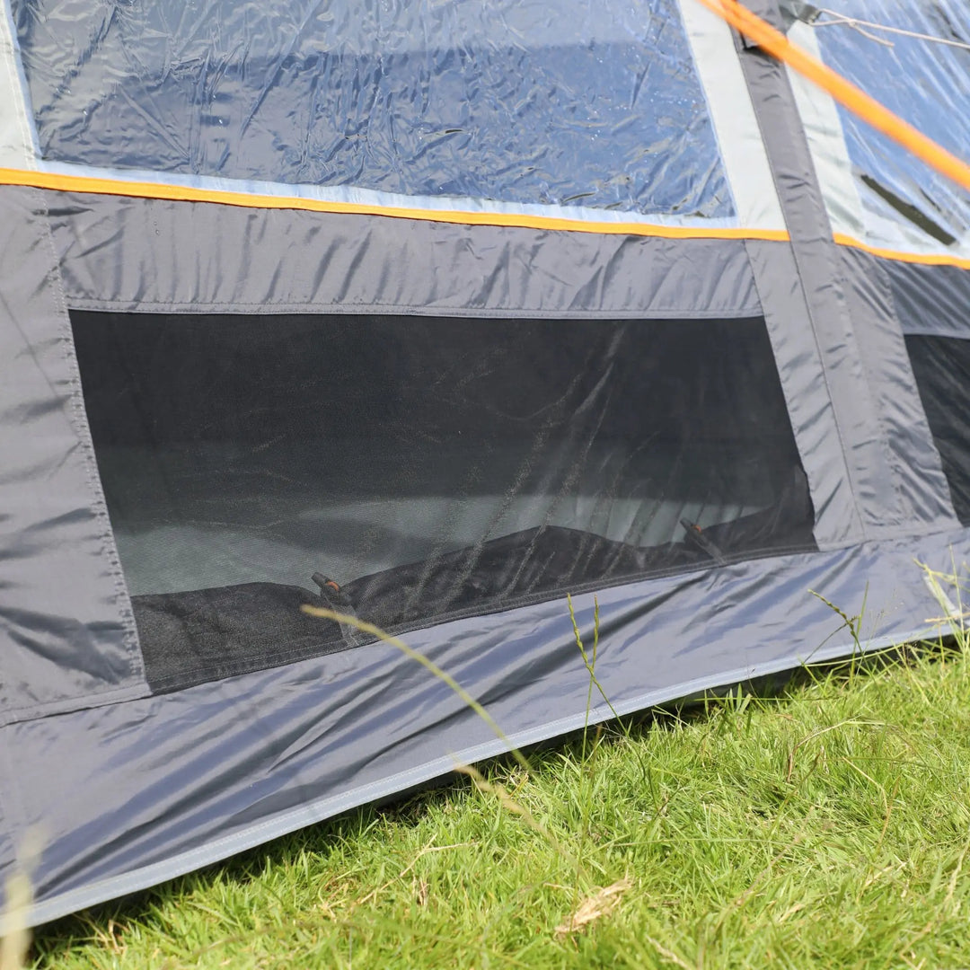 External view of the Vango Cove III Air Low awning, highlighting its large windows and ventilation panel.