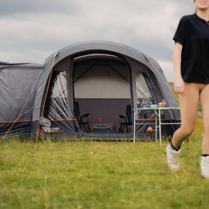 View of the entrance area of the Vango Cove III Air Low Awning with zippered doors, demonstrating ease of access for campervan camping.