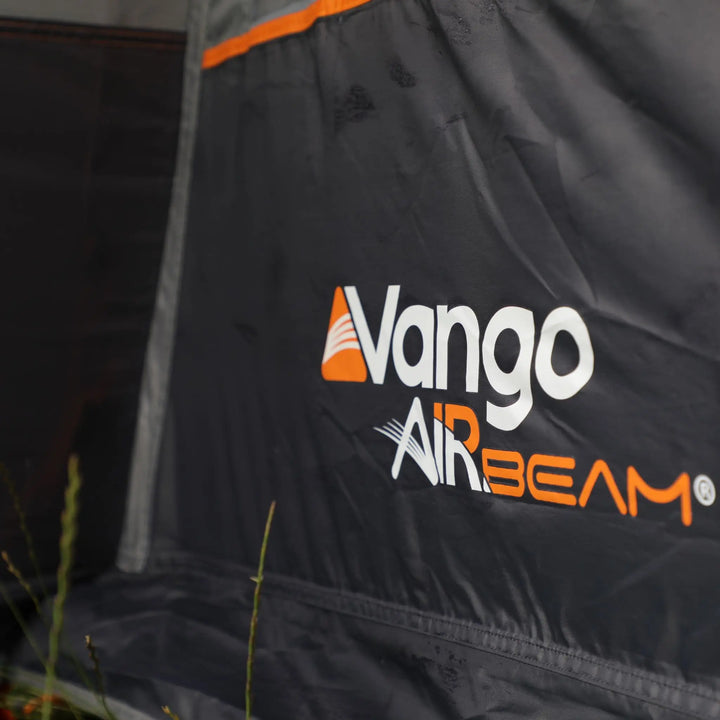 Close-up of the Vango AirBeam logo on the Cove III Air Low Drive Away Awning, emphasizing its durable inflatable frame technology.