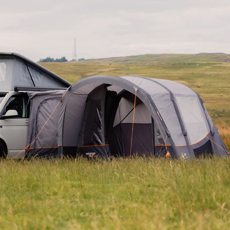 Vango Cove III Air Low attached to a vehicle in a grassy field