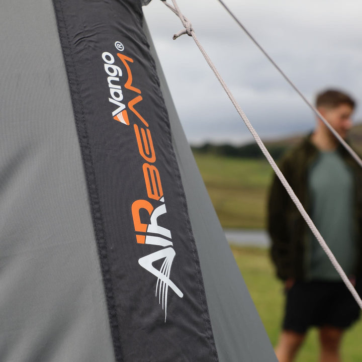 A close-up of the Vango AirBeam branding on the awning, showcasing the innovative inflatable awning technology.