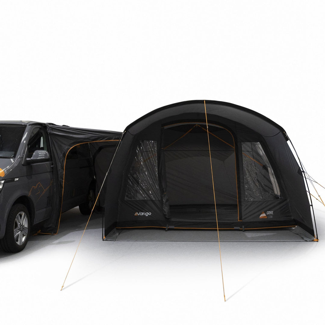 Fully open front canopy of the Vango Cove III Low poled drive away awning, providing a shaded outdoor area for campervan trips.