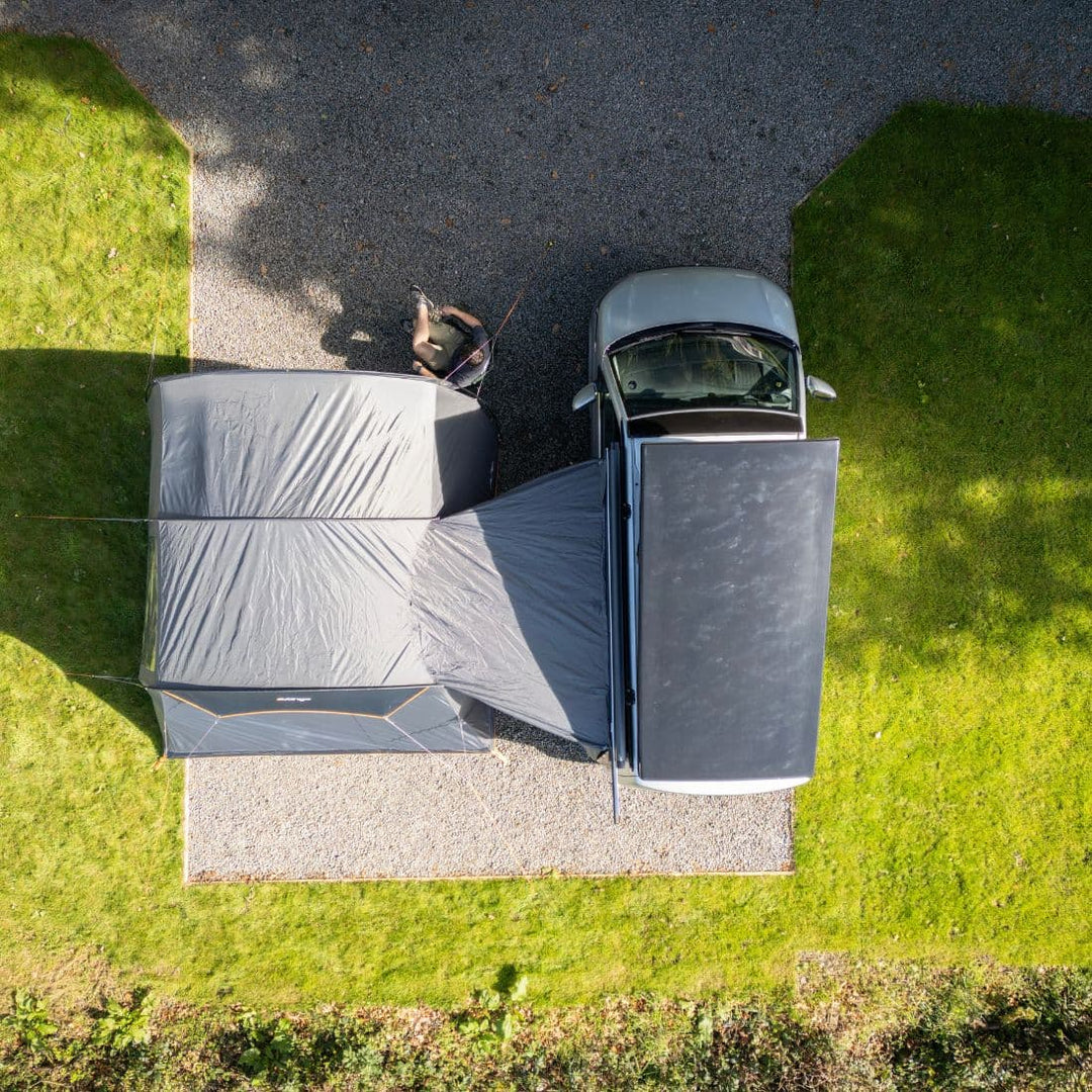 Top-down view of the Vango Cove III Low drive away awning attached to a campervan, illustrating its compact layout and connection to the vehicle.