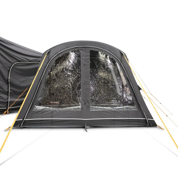 Front view of the Vango Cove Pro Air Mid Drive-Away Awning with front door and curtains open.