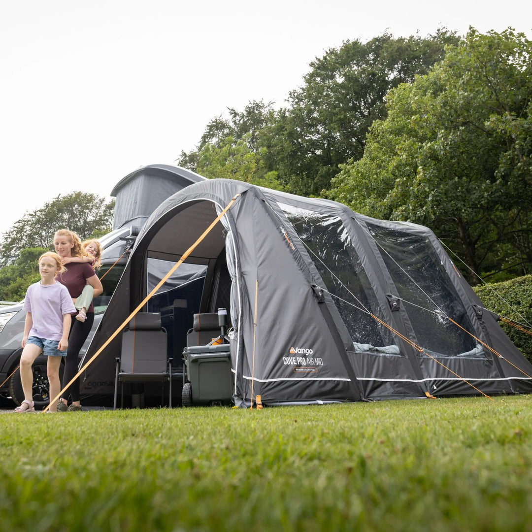 Lifestyle image of the Vango Cove Pro Air Mid Drive-Away Awning attache to a high top van.