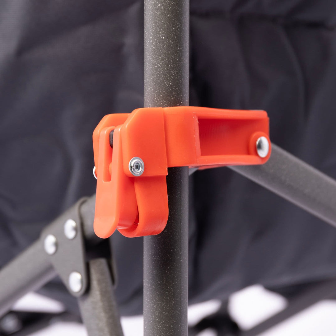 Orange locking clip on the Vango Crater Camping Chair's steel frame, ensuring secure setup for outdoor use.